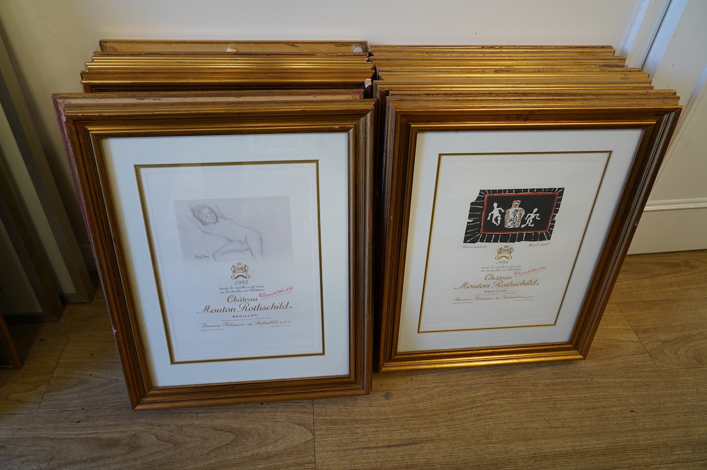 A set of fifteen Mouton Rothschild vintage wine label prints, framed, each 35 x 26cm. Condition - good